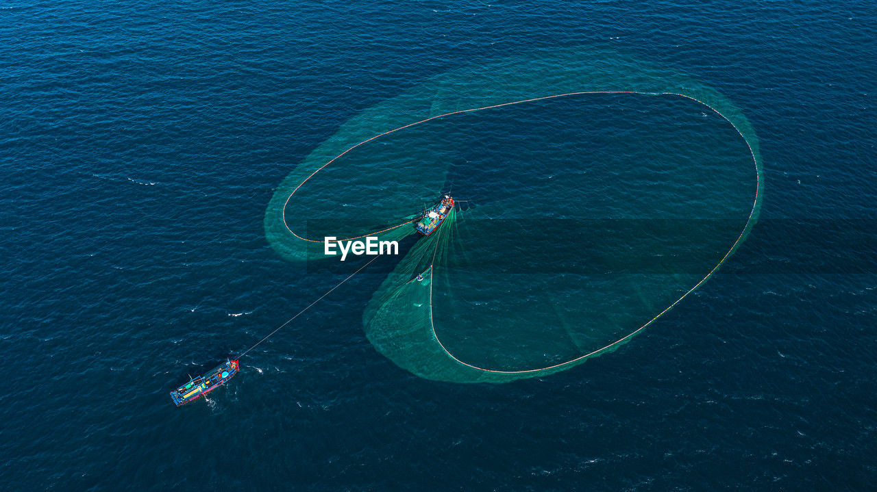 high angle view of man swimming in sea