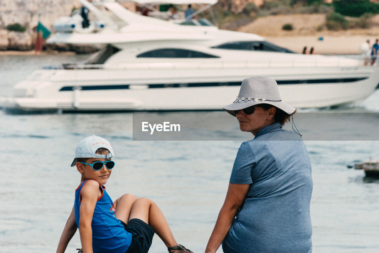 Mother and son enjoying vacation at beach