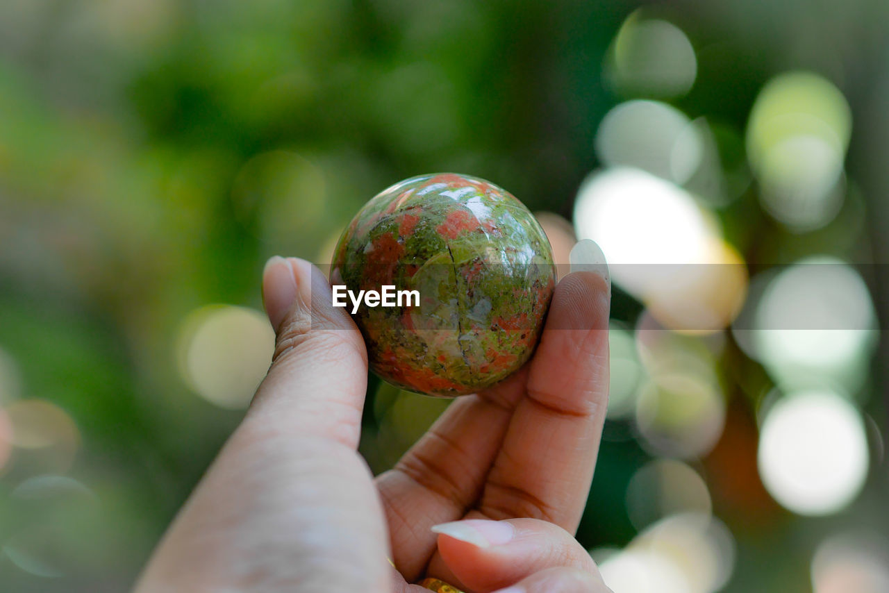 Close-up of hand holding ball