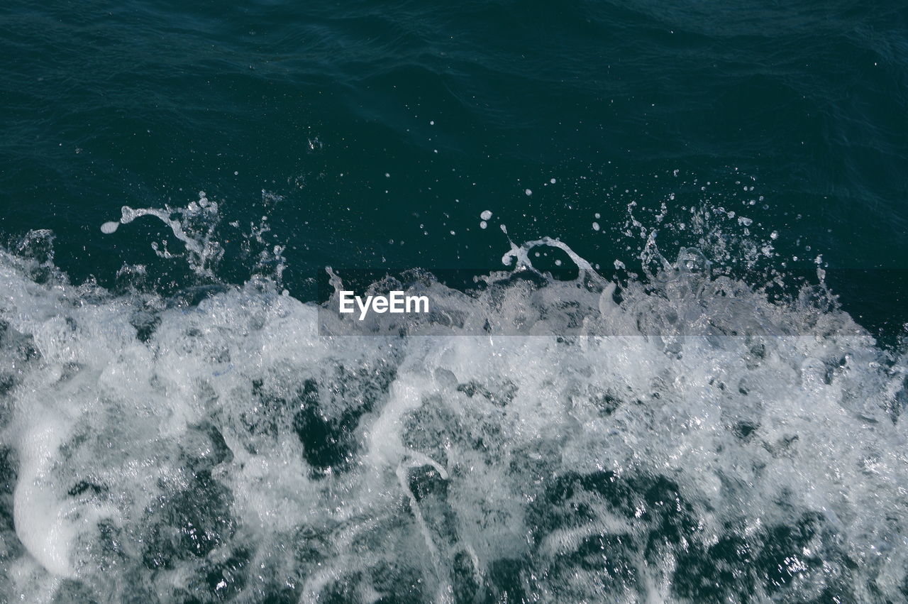 High angle view of water splashing in sea