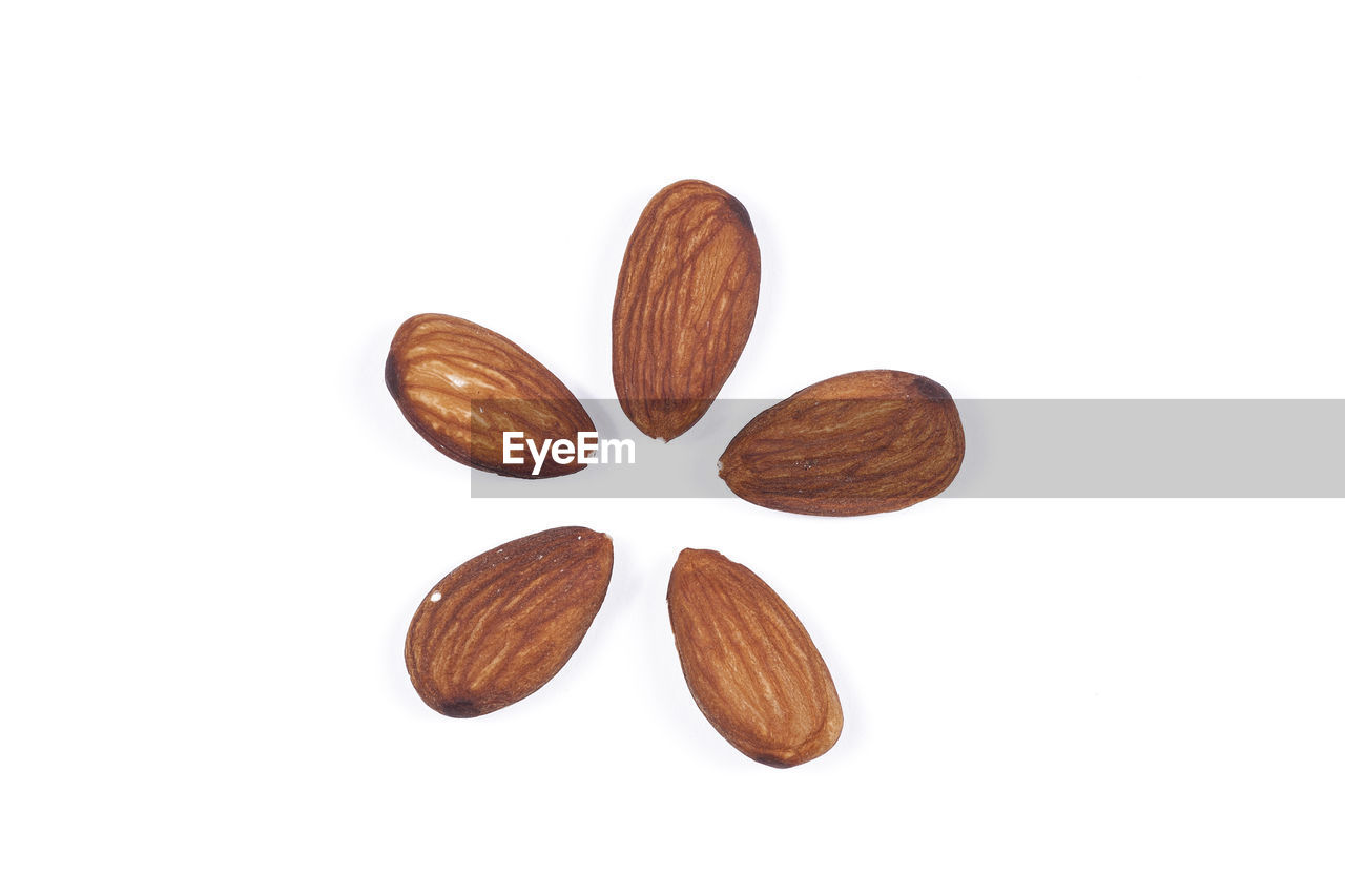 Close-up of almonds against white background