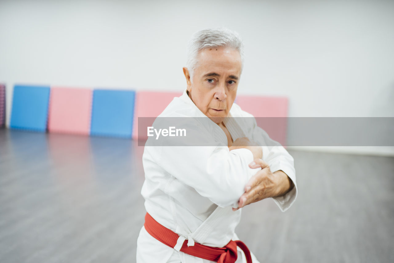 Senior karate master performing combat techniques