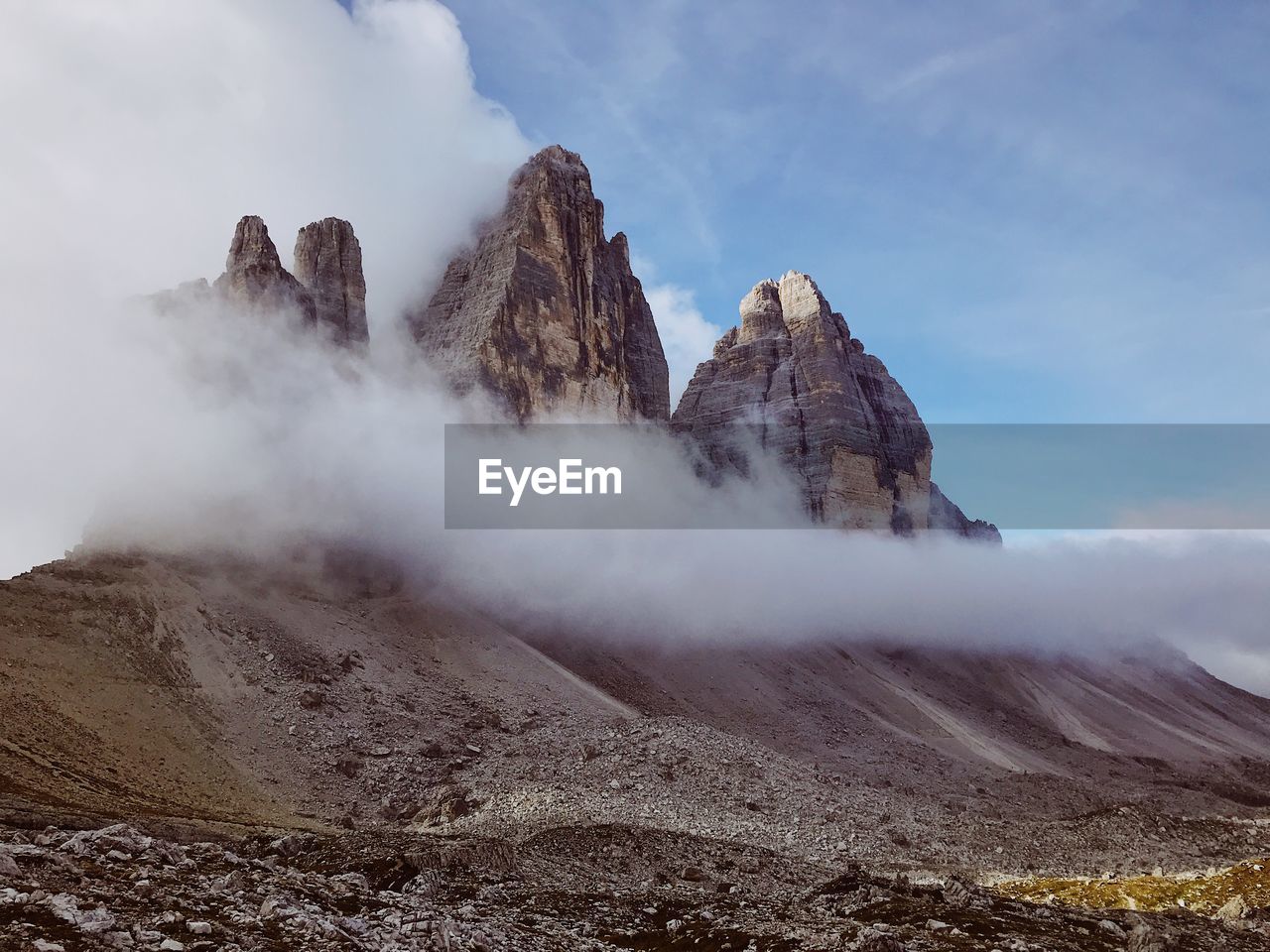Low angle view of rock mountains against sky