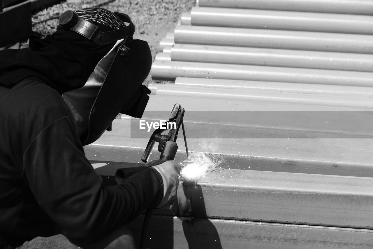 Man working on metal in factory