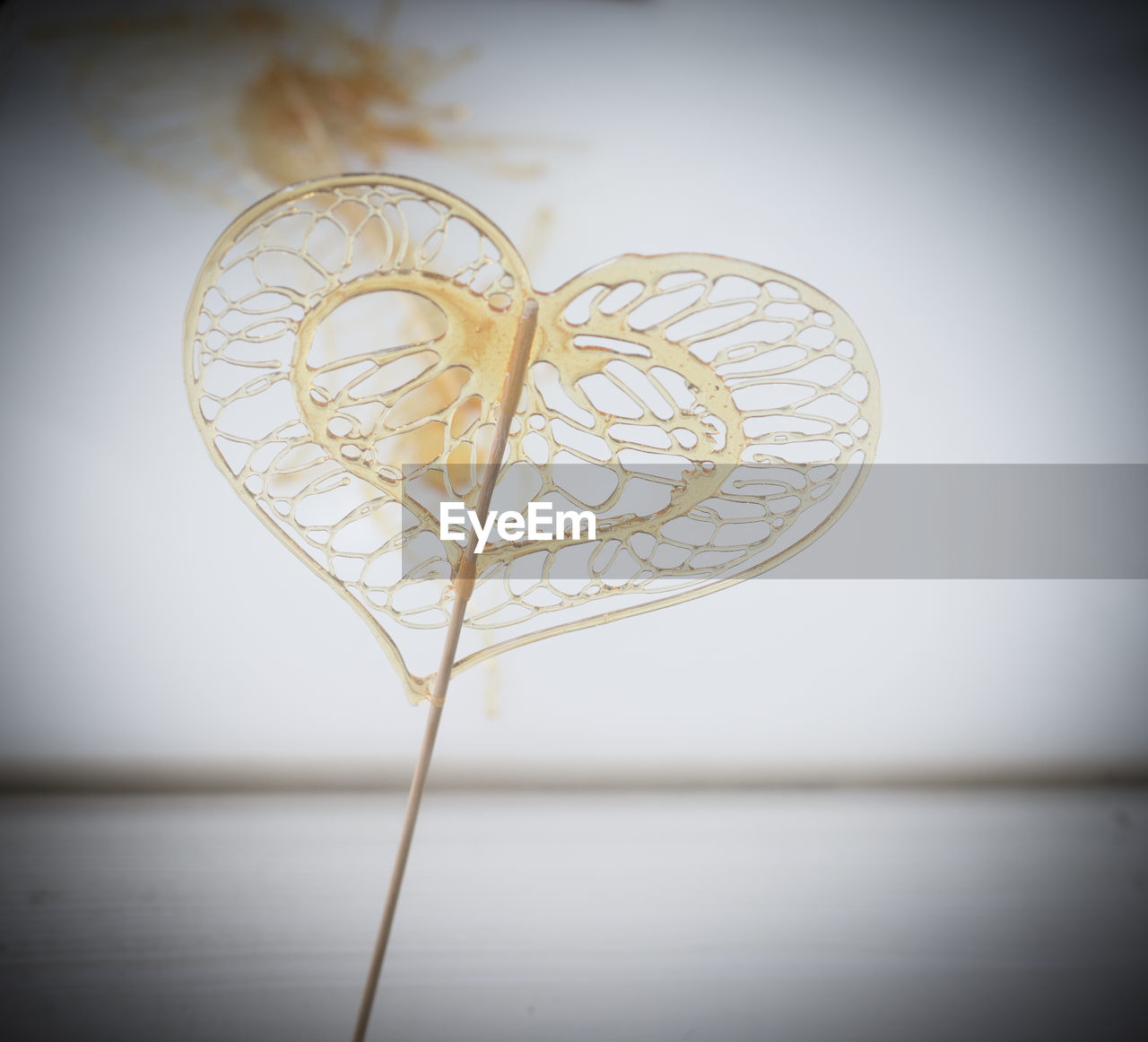 CLOSE-UP OF HEART SHAPE ON TABLE WITH TEXT