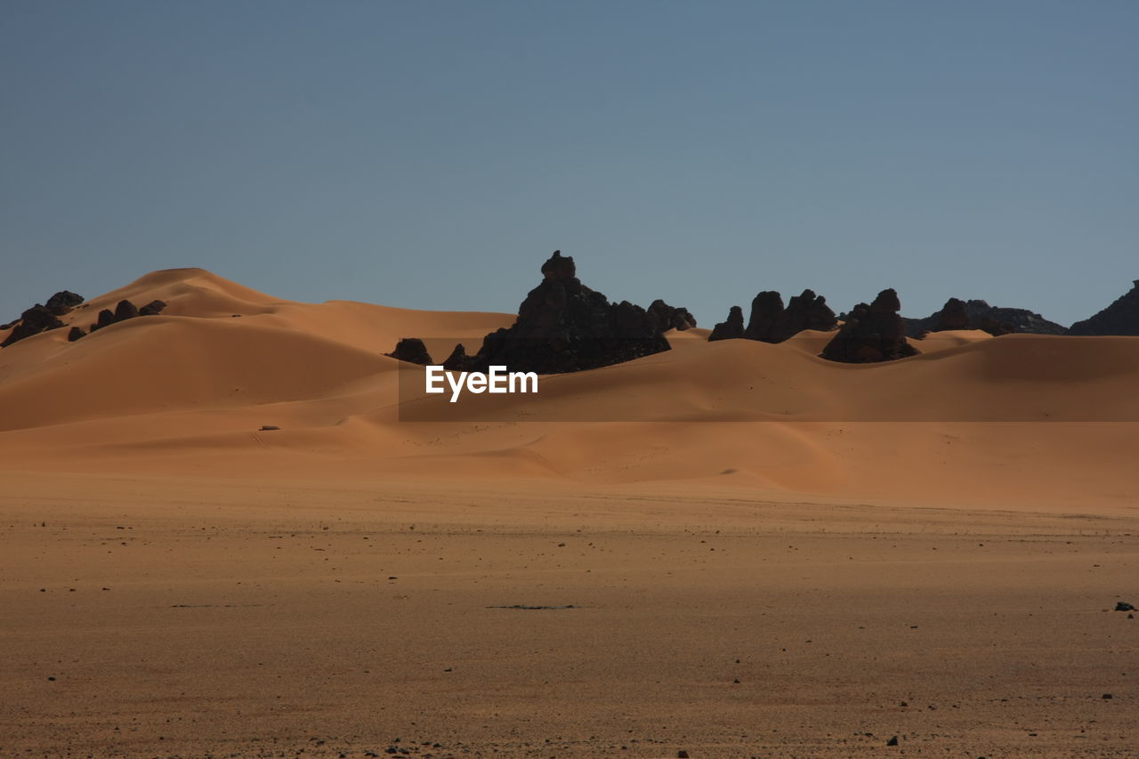 Scenicof desert against clear sky acacus mountains, libya