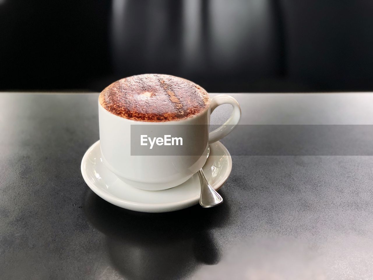 Close-up of coffee cup on table