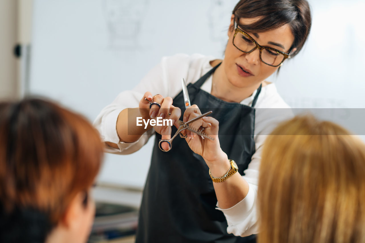 Haircutting training and education program in hair salon with mannequin head