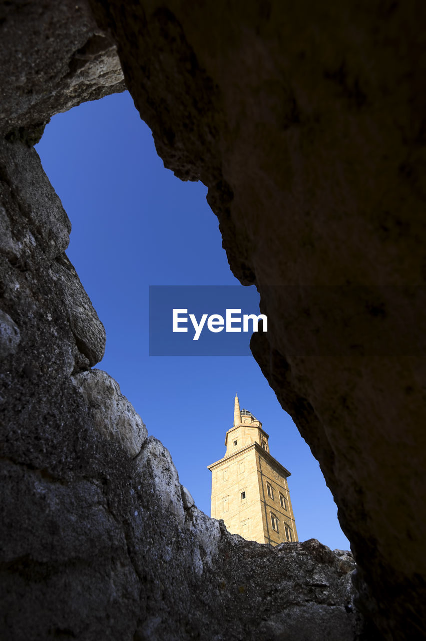 Tower of hercules seen amidst rock