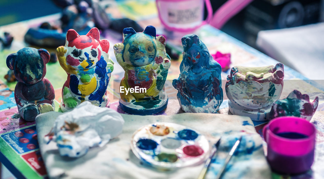 multi colored, craft, blue, no people, creativity, toy, table, representation, figurine, large group of objects, still life, paint, selective focus, variation, retail