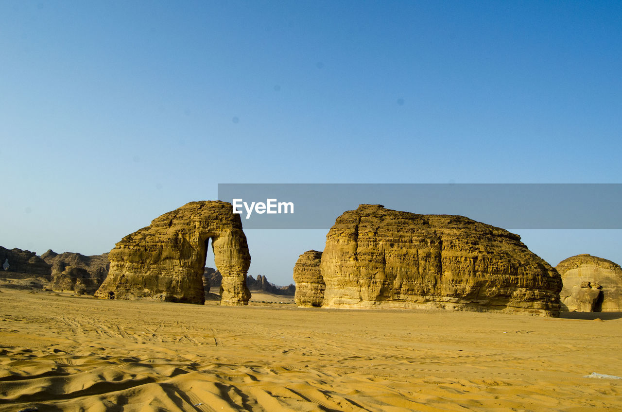 ROCK FORMATIONS AGAINST CLEAR SKY