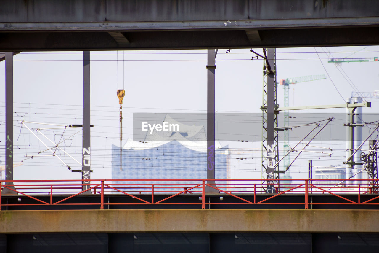 Elbphilharmonie by bridge against sky