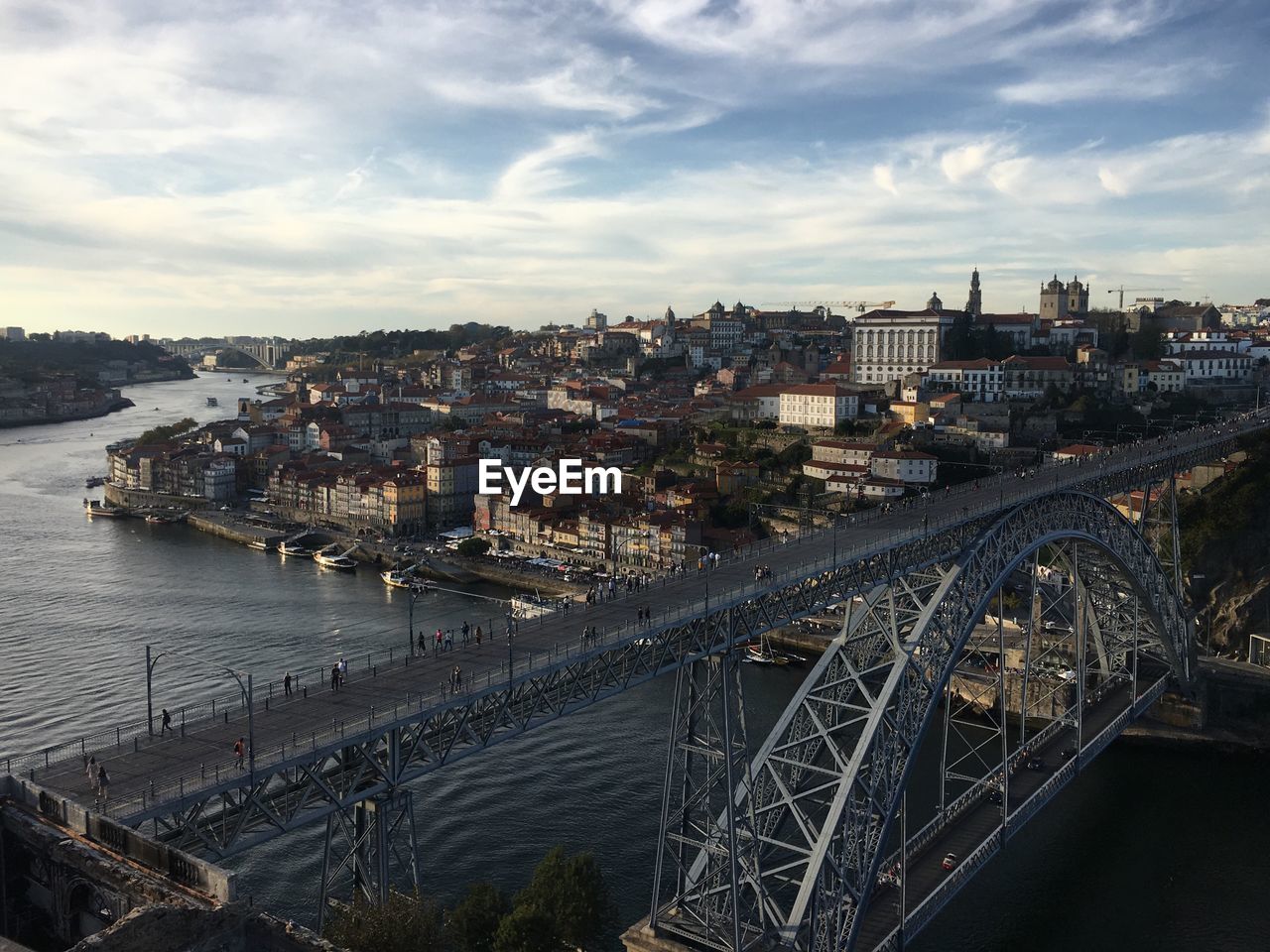 HIGH ANGLE VIEW OF BRIDGE OVER RIVER AGAINST SKY