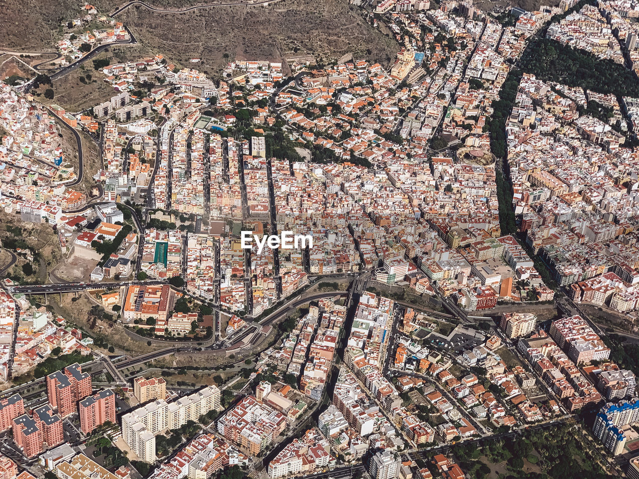 High angle view of illuminated buildings in city