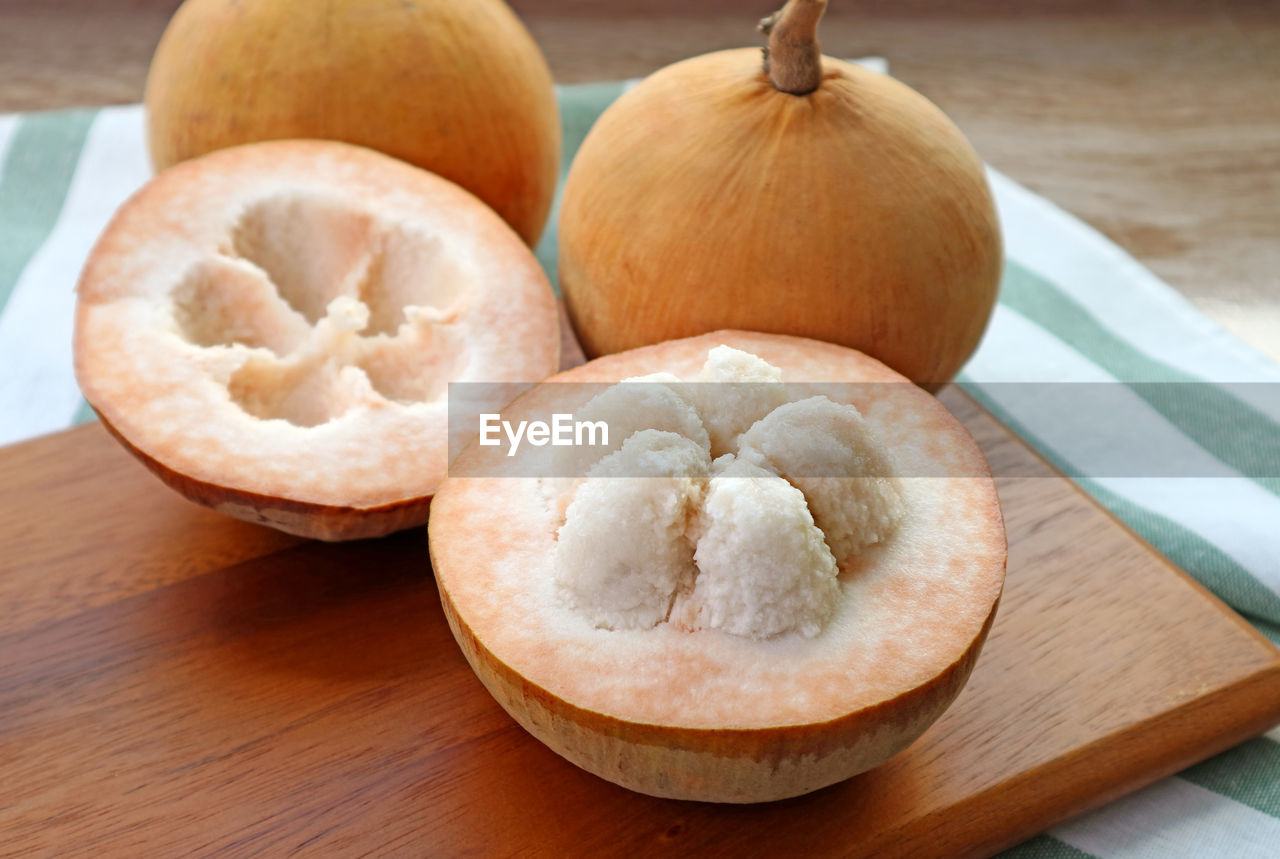 Closeup an opened sweet and sour fresh ripe cotton fruit or santol fruit