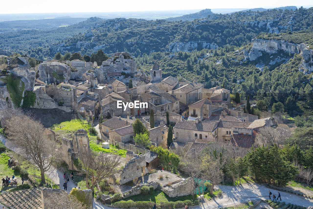 HIGH ANGLE VIEW OF TREES AND CITY