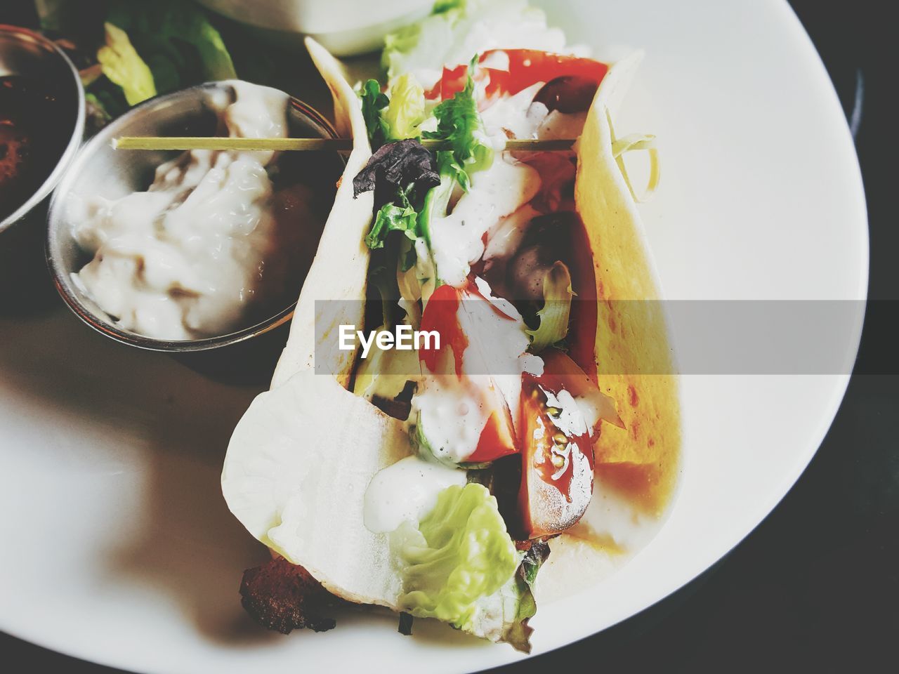 Close-up of taco served in plate on table