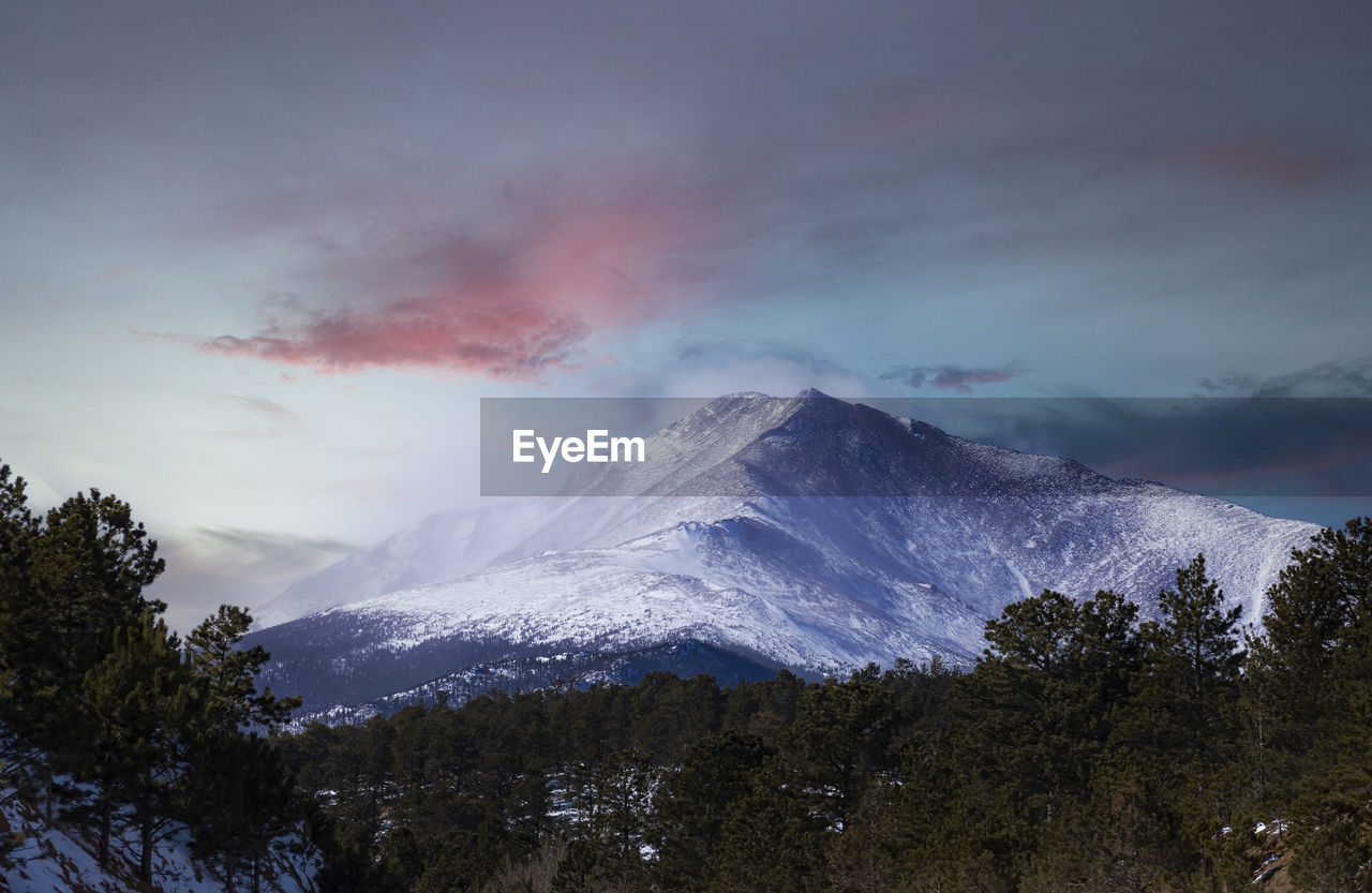 Ominous sunset over top the rocky mountains 