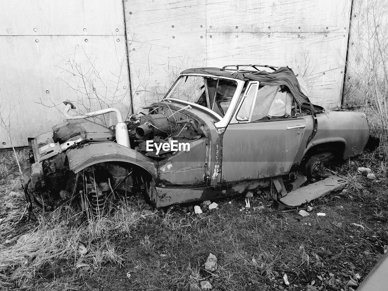 High angle view of abandoned car on field