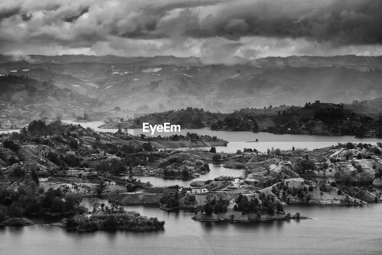 Scenic view of river and landscape against sky