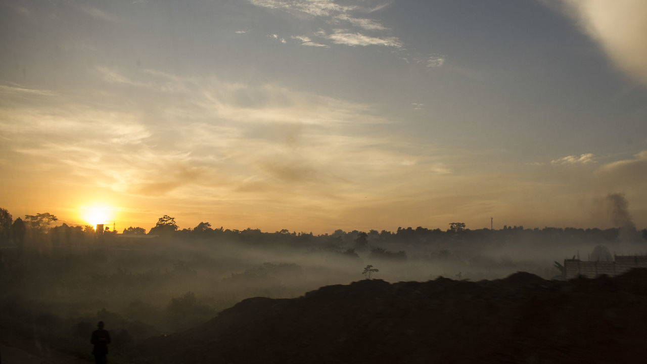 SUNSET OVER LANDSCAPE