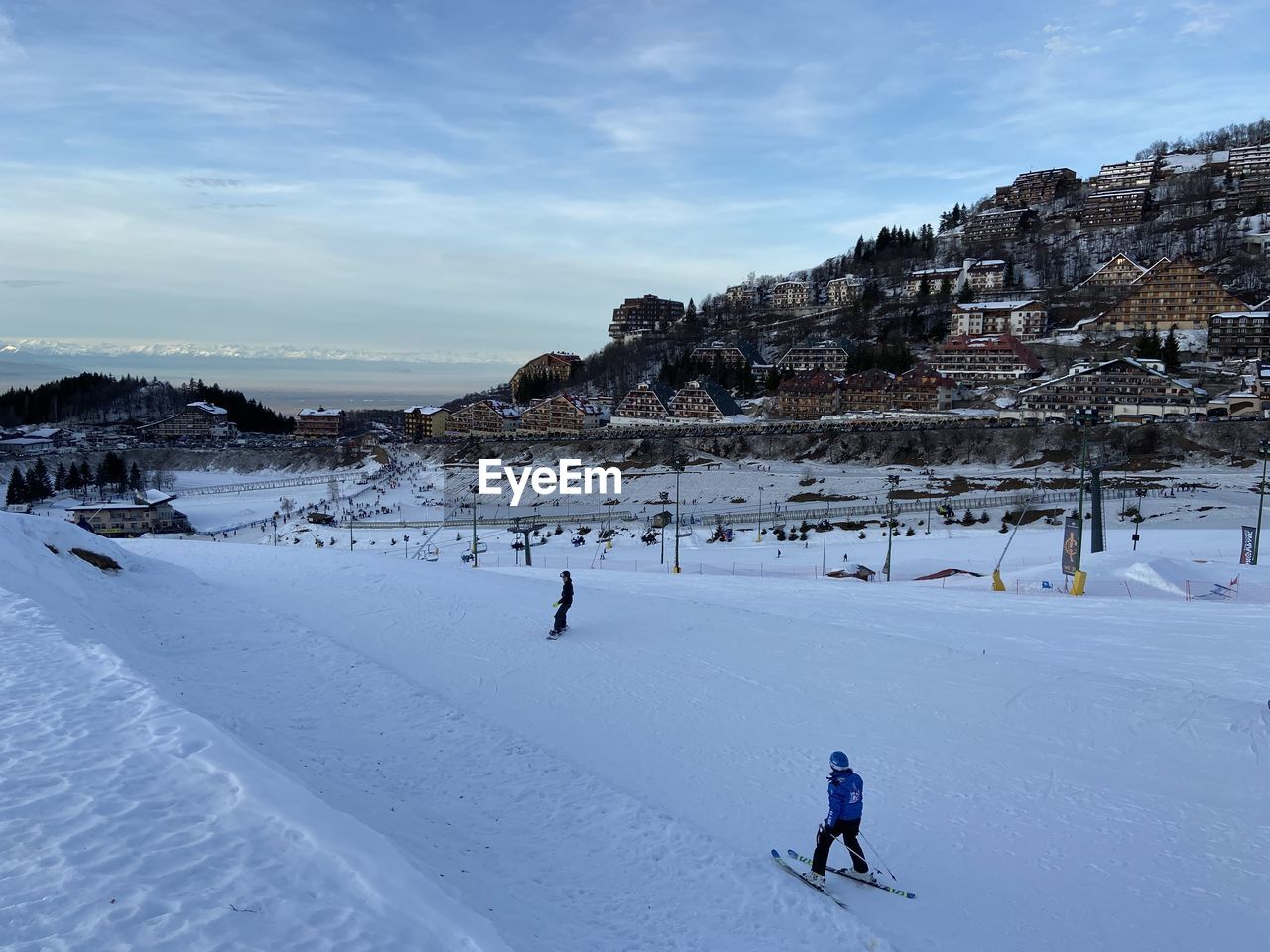 PEOPLE SKIING ON SNOW LAND