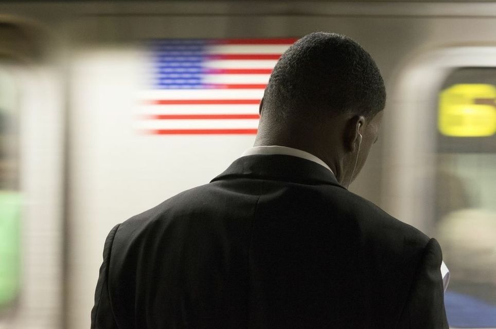 CLOSE-UP OF YOUNG WOMAN STANDING ON WALL