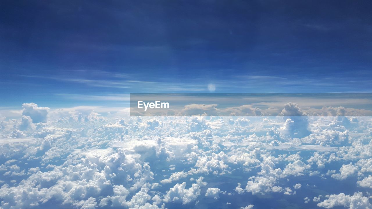 AERIAL VIEW OF CLOUDS OVER LANDSCAPE