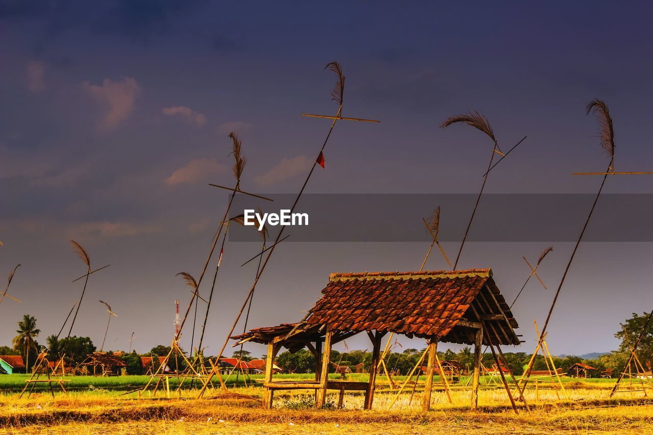 FARM ON FIELD AGAINST SKY