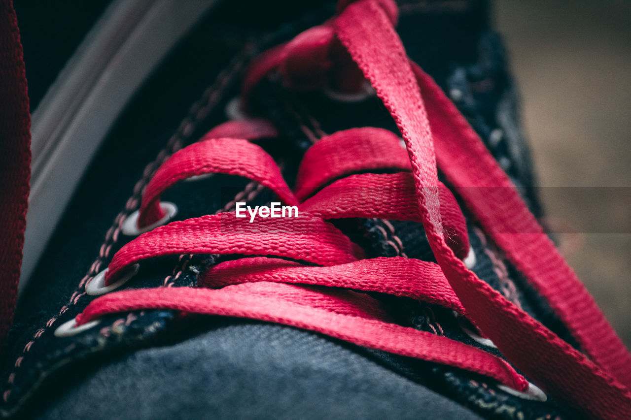 High angle view of red lace of shoes