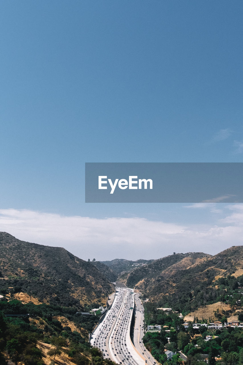 High angle view of landscape against blue sky