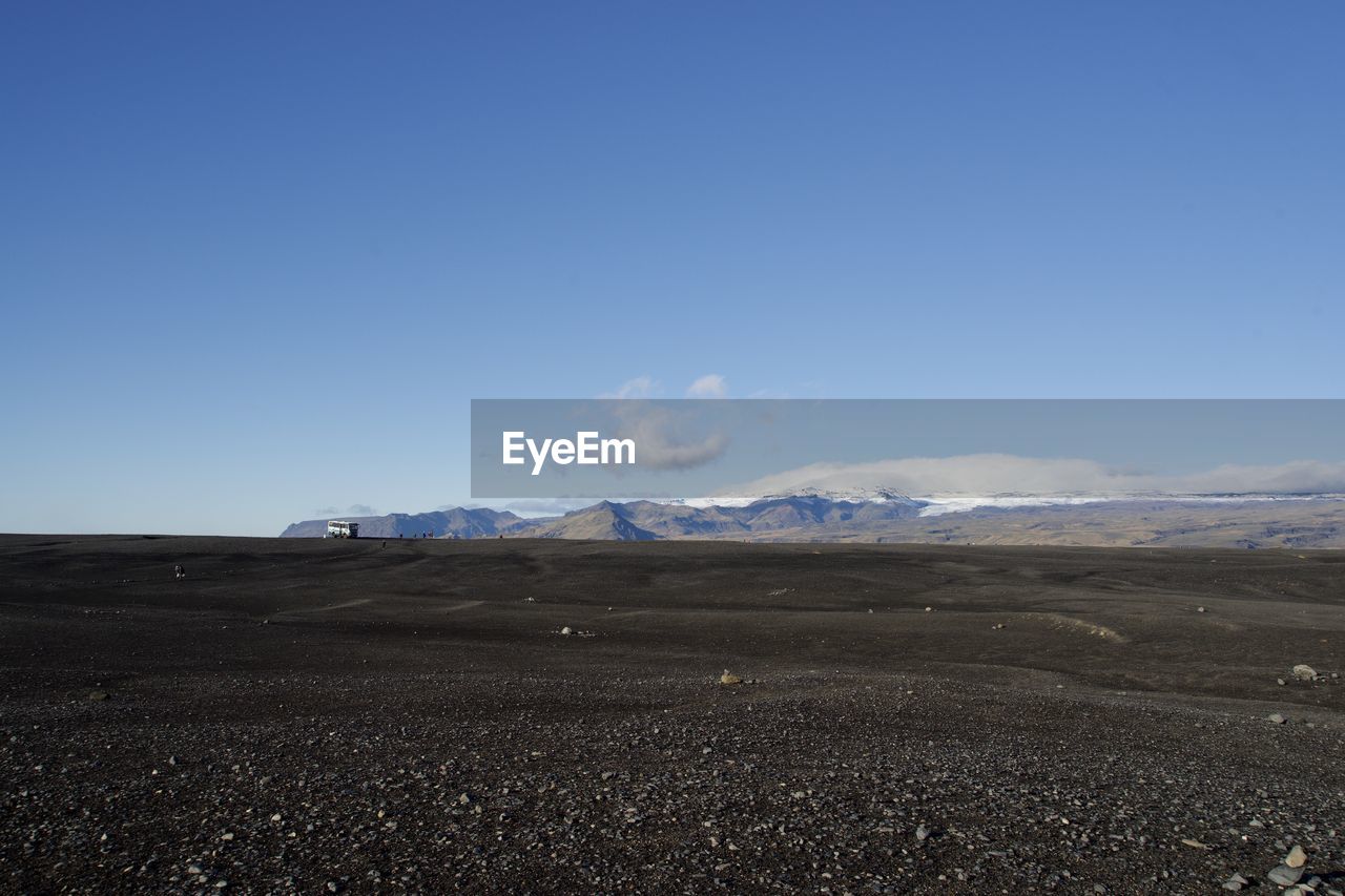 LANDSCAPE AGAINST BLUE SKY