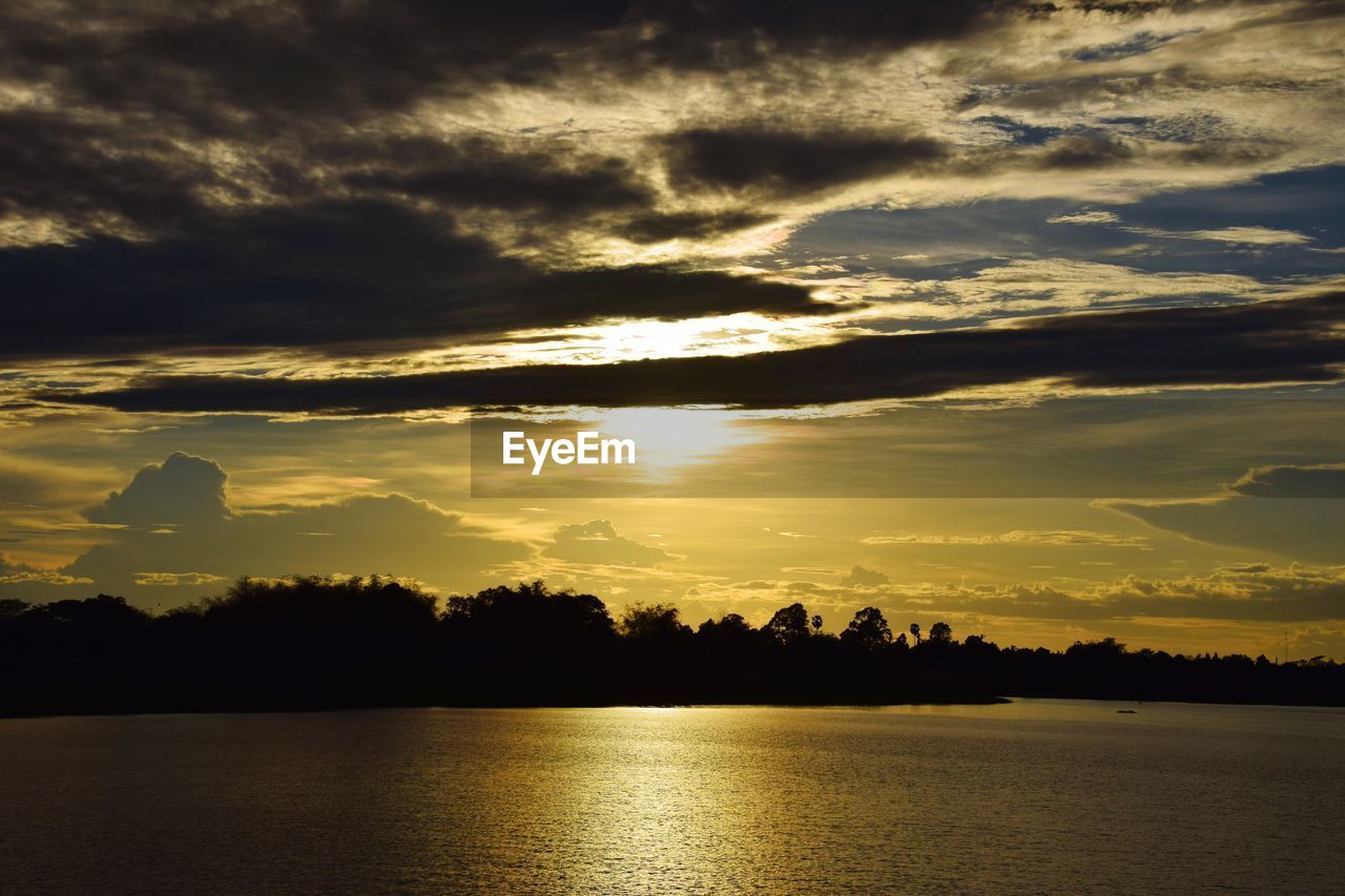 Scenic view of lake against sky during sunset