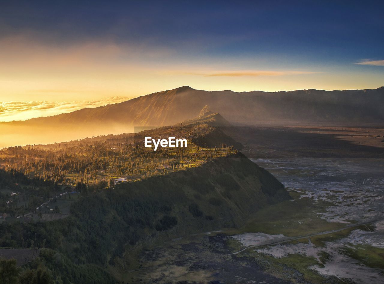 SCENIC VIEW OF MOUNTAINS DURING SUNSET