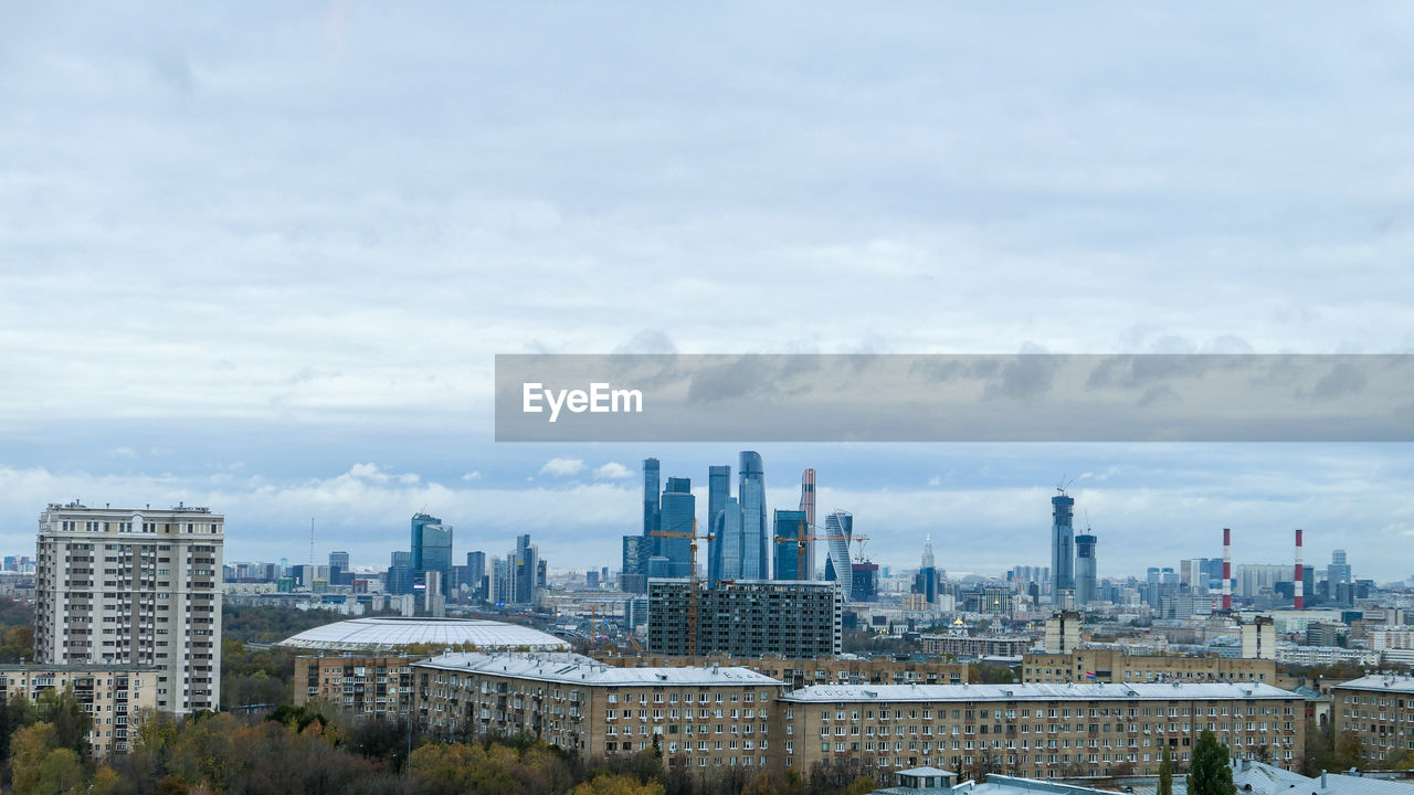 Panoramic view of autumn cityscape of moscow under dramatic cloudy sky