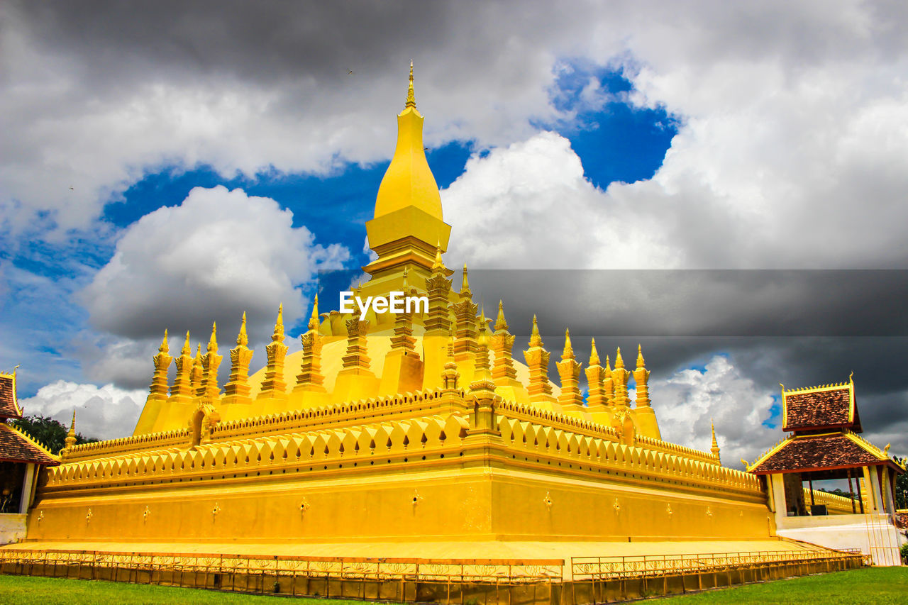 LOW ANGLE VIEW OF TEMPLE AGAINST BUILDINGS