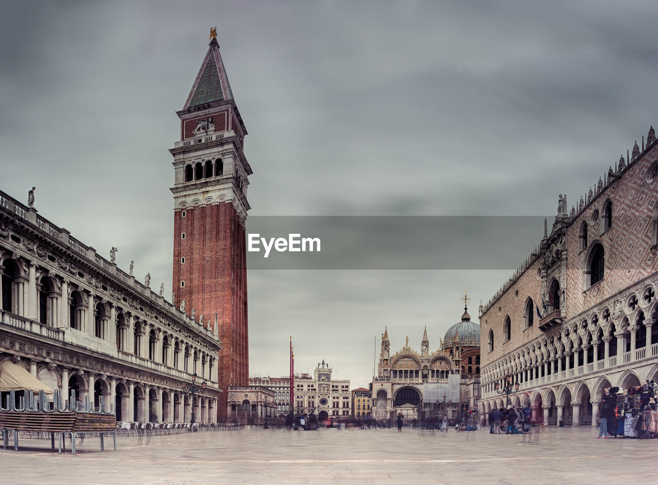 View of cathedral in city against cloudy sky