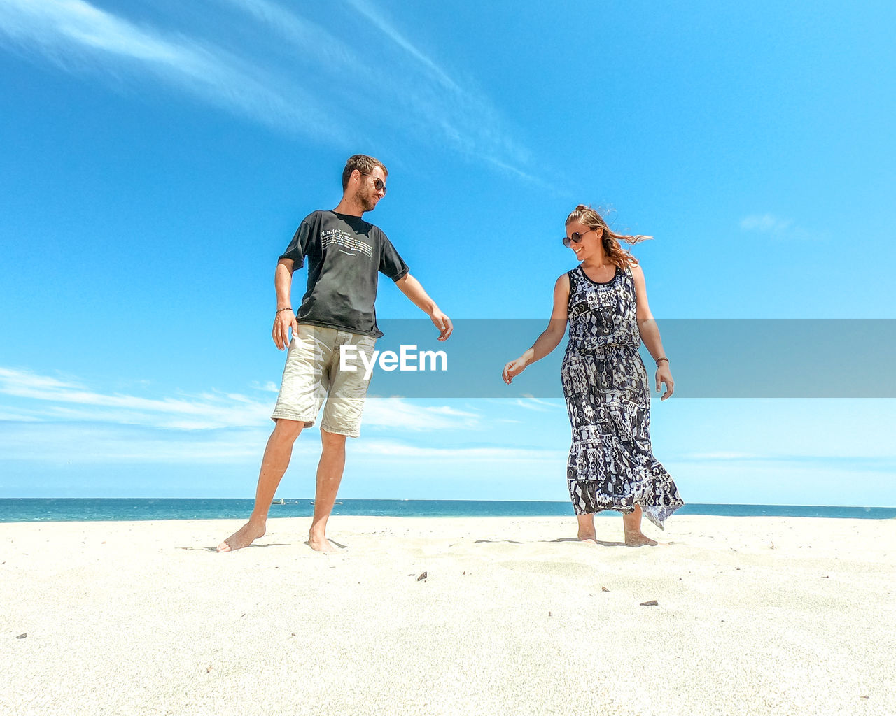 Friends standing at beach
