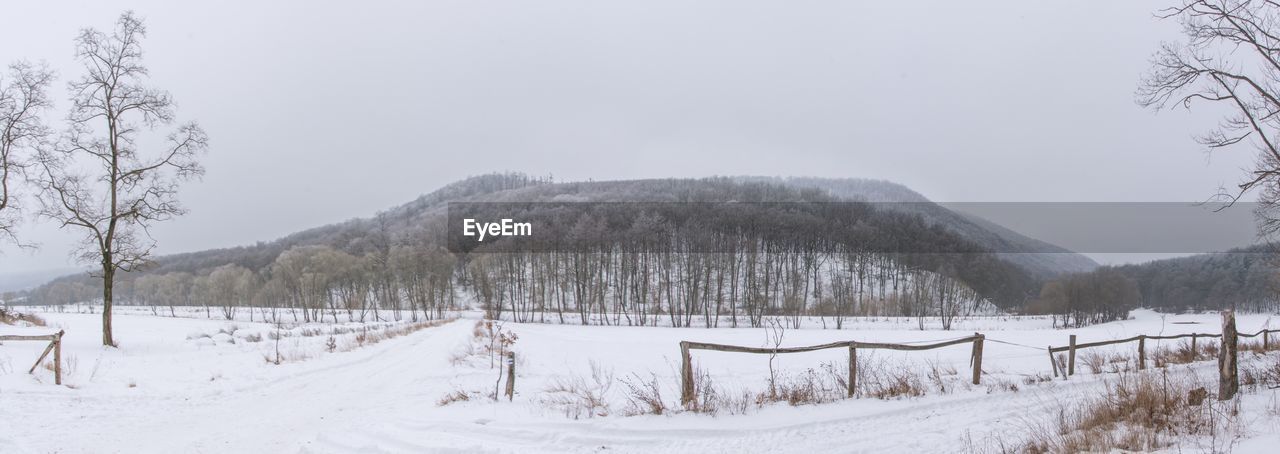 Panoramic view of landscape against clear sky during winter