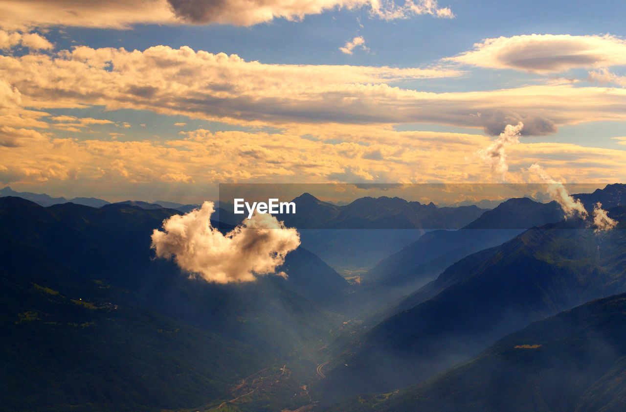 Scenic view of mountains against dramatic sky