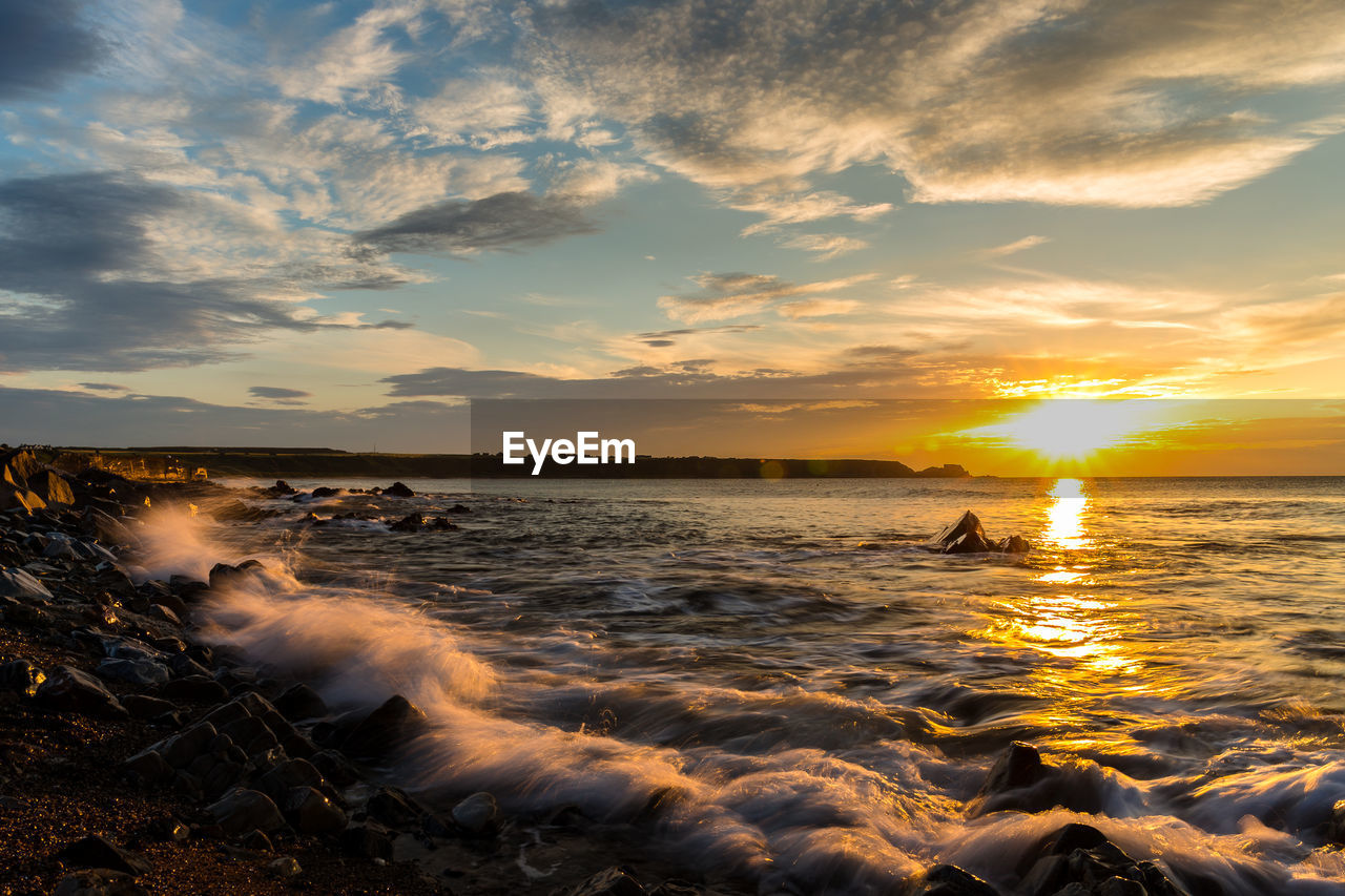 Scenic view of sea against sky during sunset