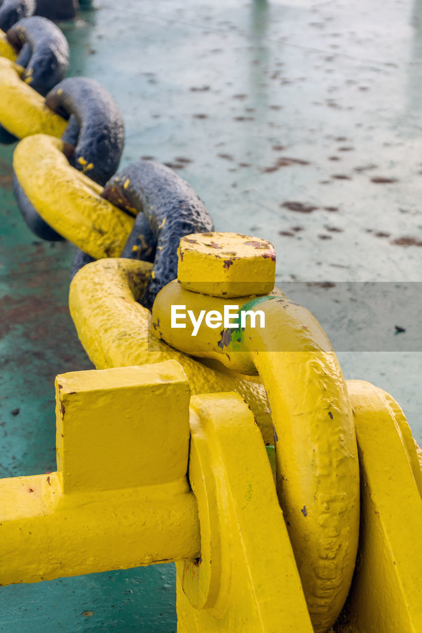 Anchor mooring chain secured to smit bracket on deck of a construction barge at offshore oil field