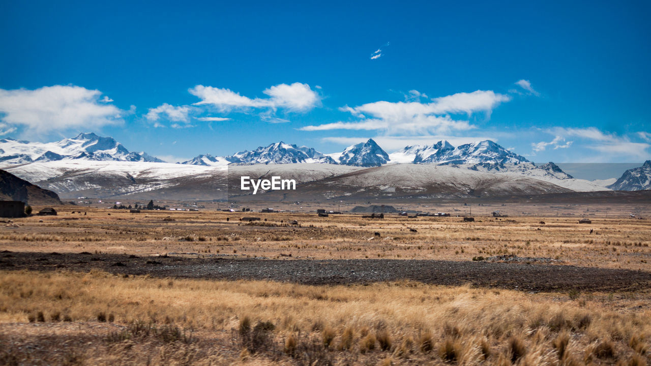 Scenic view of snowcapped mountains against sky