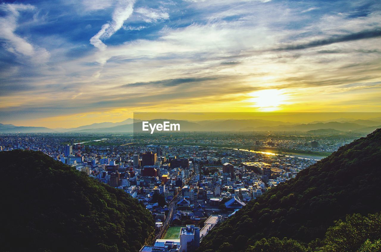 High angle view of townscape against sky during sunset