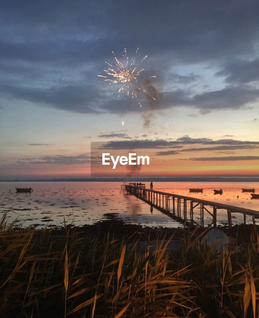 Scenic view of sea against sky at sunset