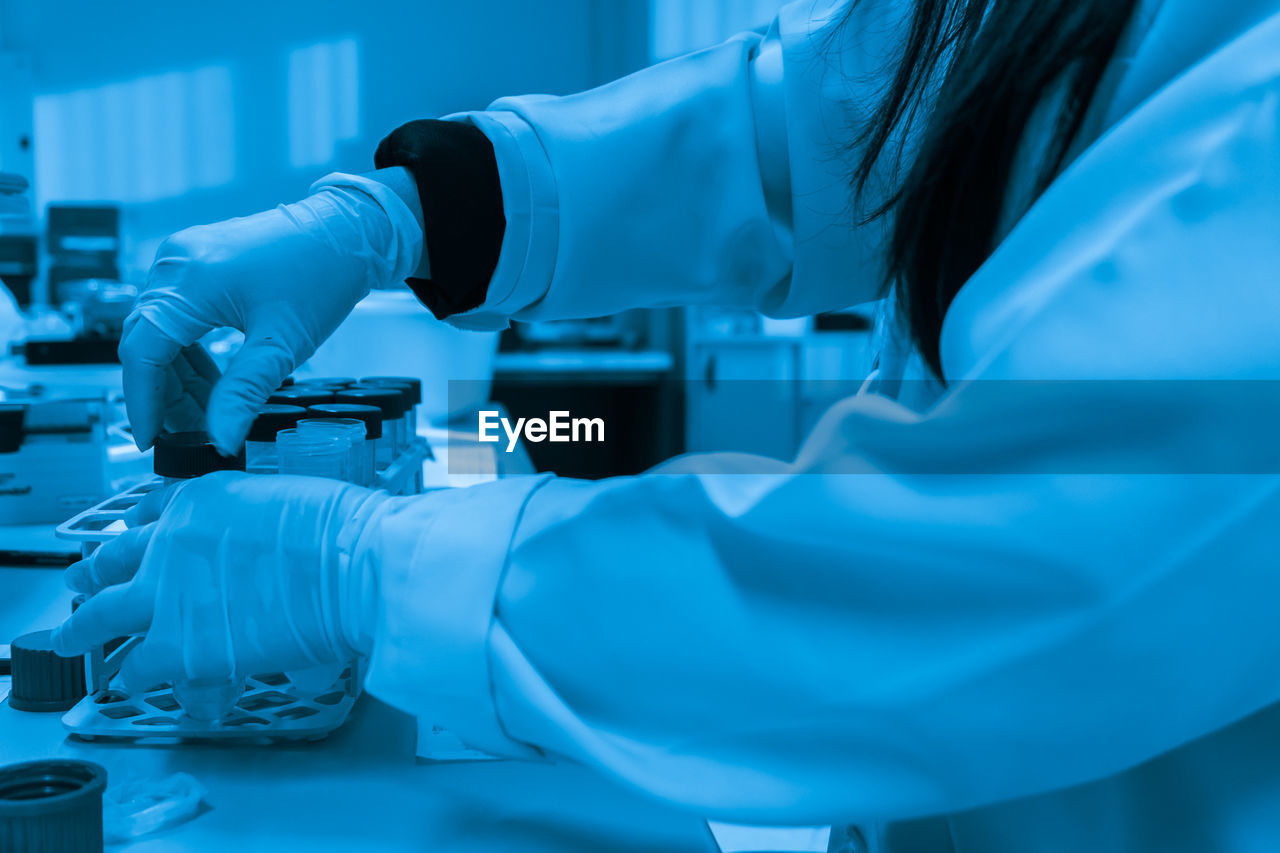 Cropped hand of scientist working in laboratory