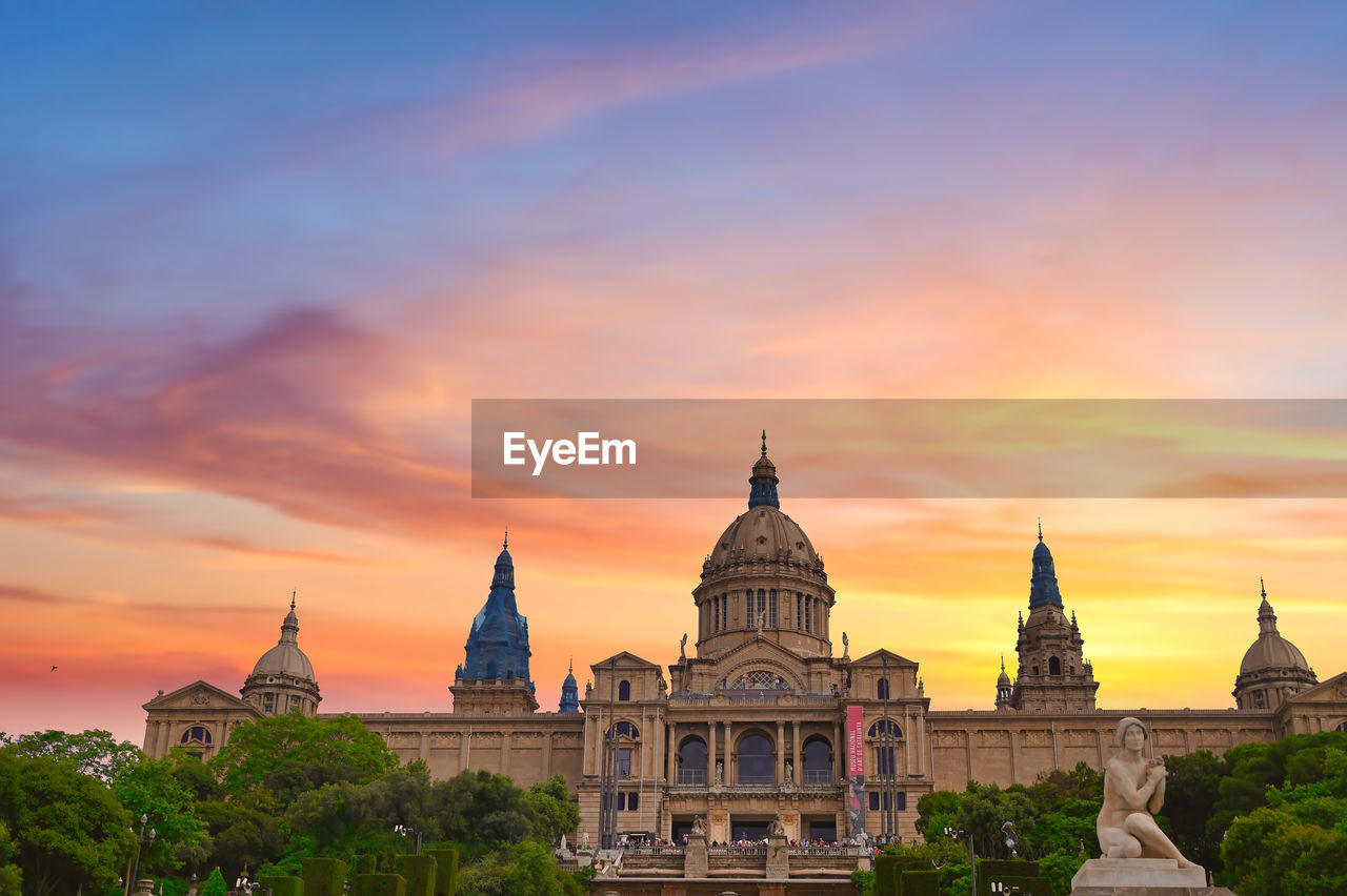 VIEW OF BUILDINGS AGAINST SKY DURING SUNSET