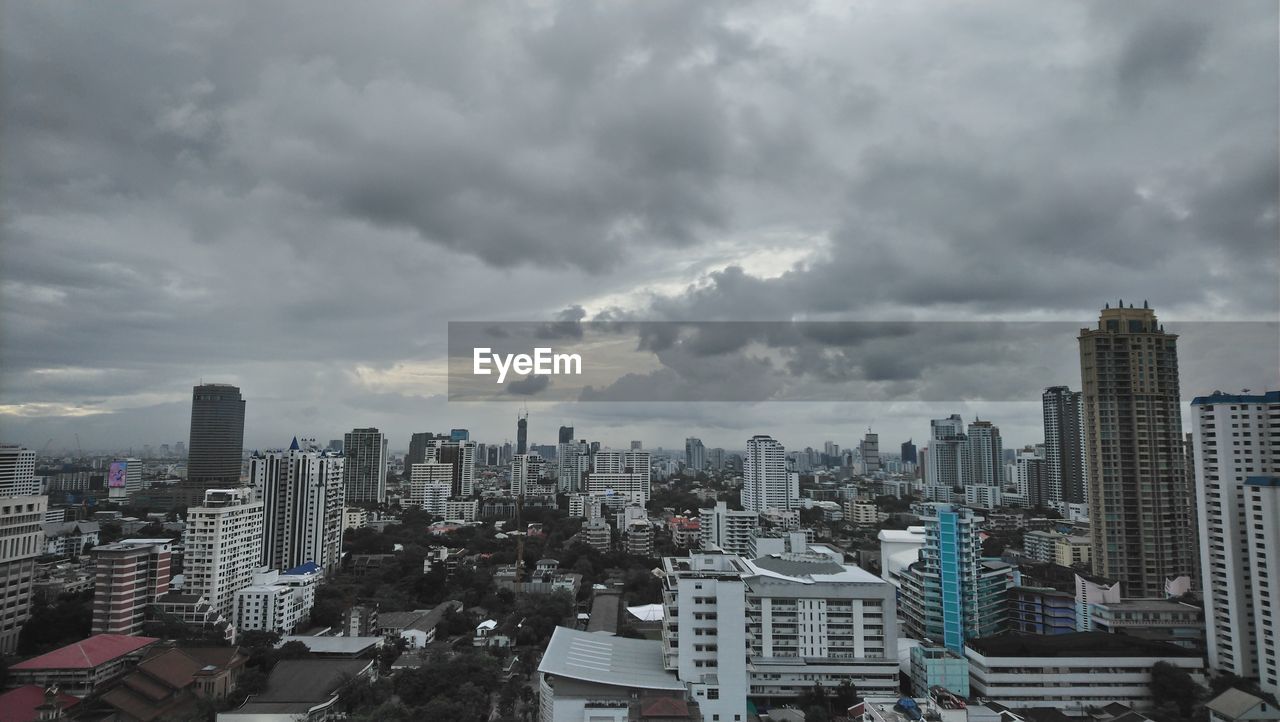 High angle view of modern buildings in city against sky