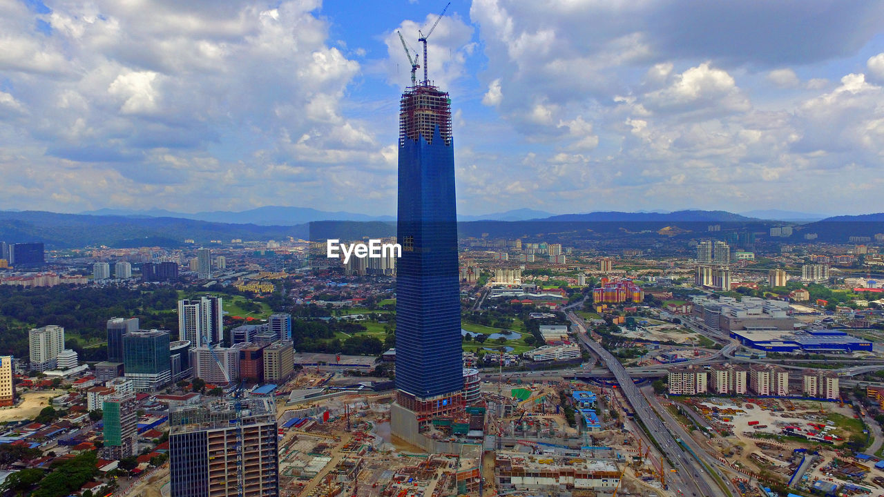 High angle view of buildings in city against sky