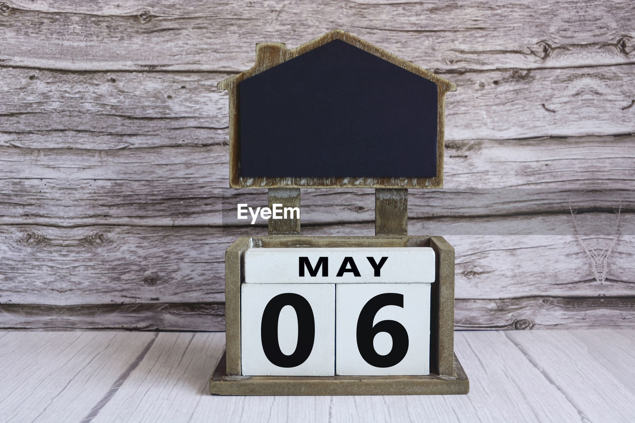 wood, communication, text, no people, white, wall - building feature, picture frame, number, sign, indoors, plank
